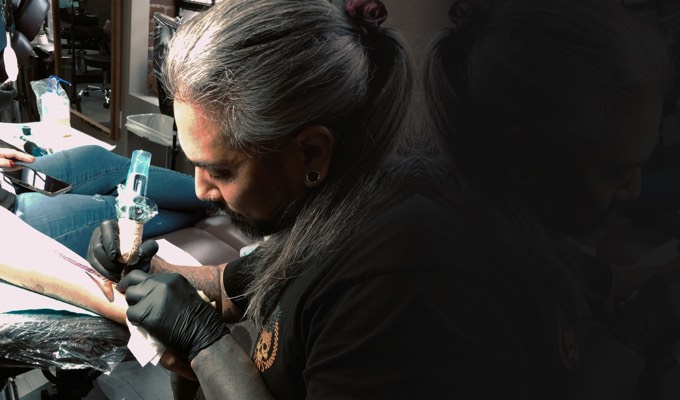 Tattoo artist Alejandro Acosta