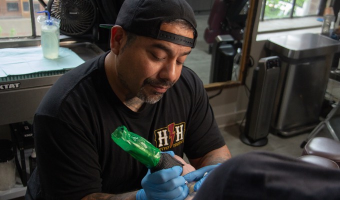 Tattoo artist Brandon Arias
